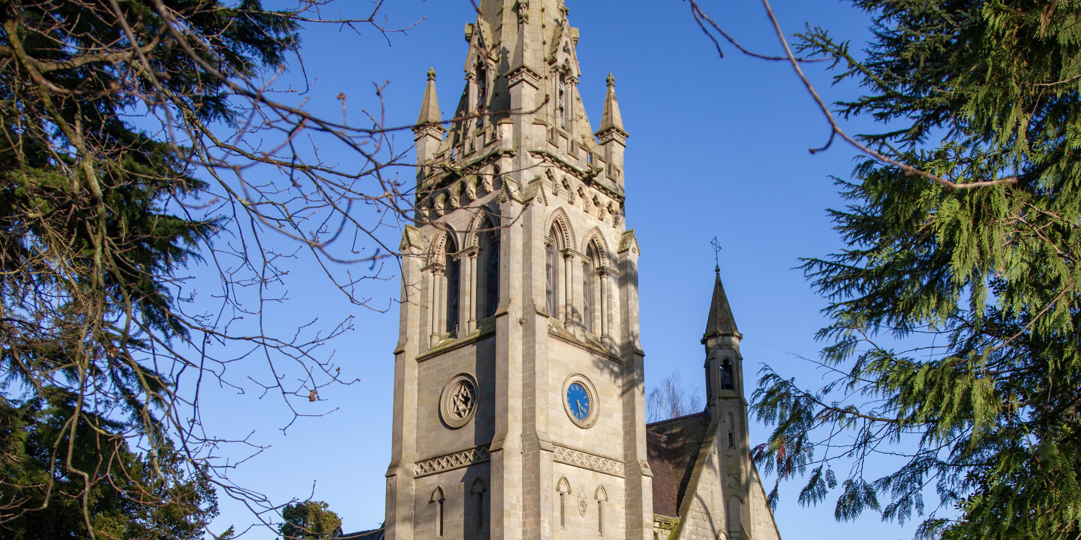 Photo of church exterior with turret clock